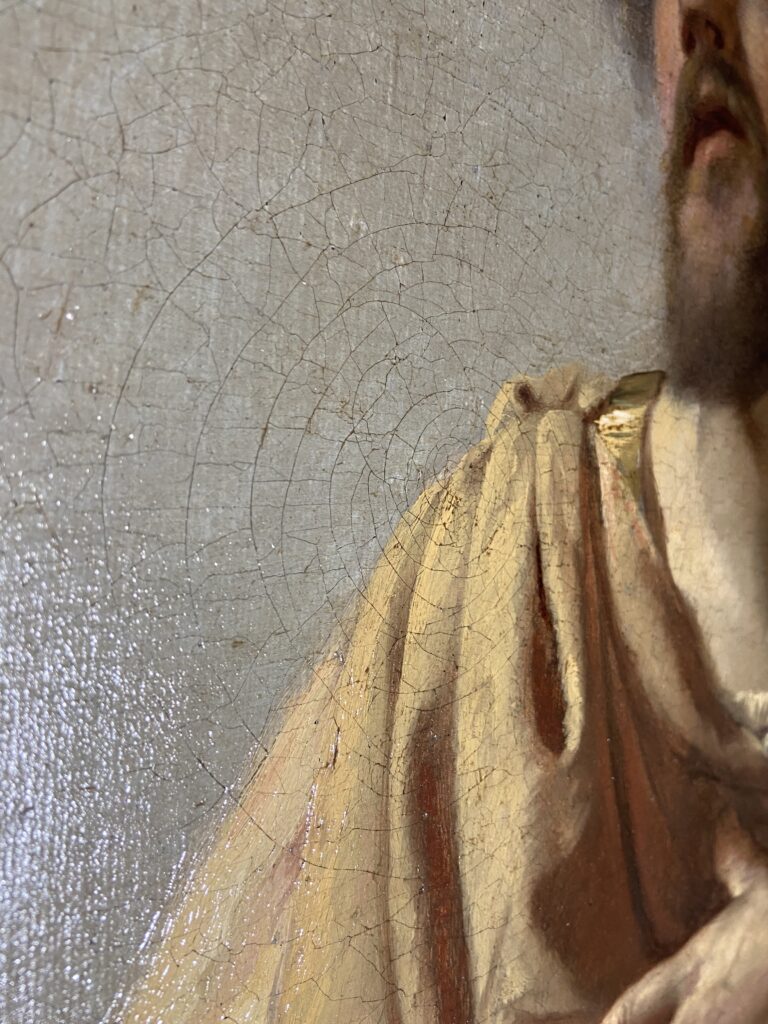 Crettature su un dipinto antico osservate in laboratorio di restauro a Darfo Boario Terme, Valle Camonica